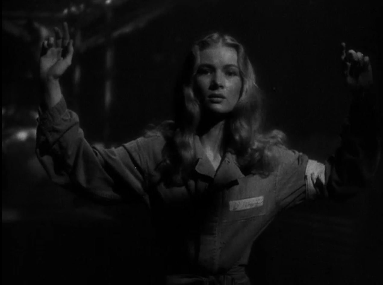 Veronica Lake appears to surrender to the Japanese in So Proudly We Hail (1943).